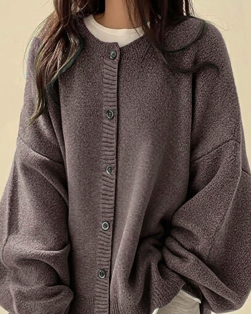 Women's oversized textured knit cardigan with round neck and button front