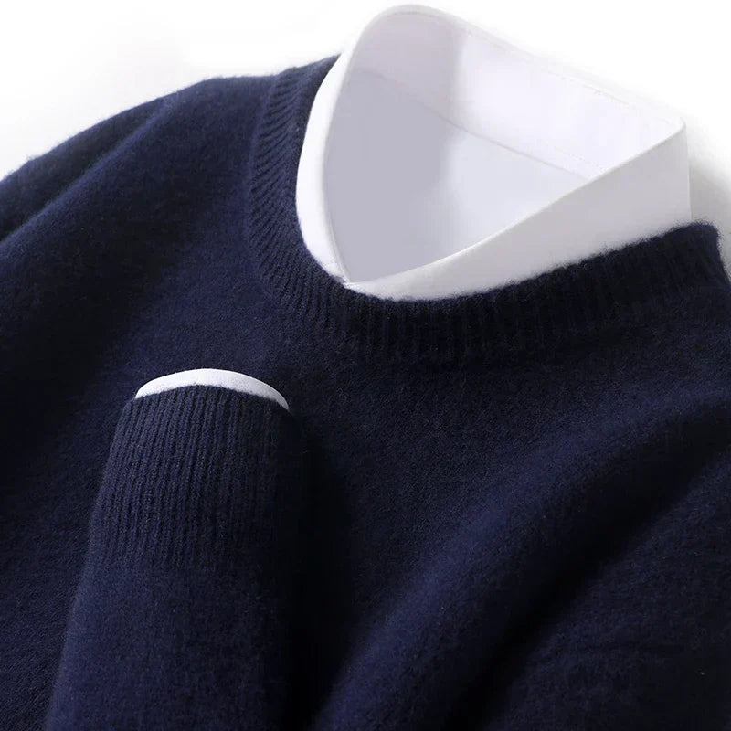 Men's textured knit crew neck sweater shown in light blue and black with long sleeves and ribbed edges