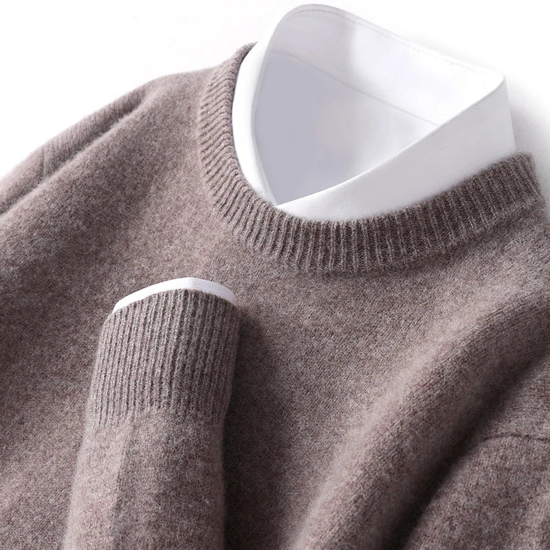 Men's textured knit crew neck sweater shown in light blue and black with long sleeves and ribbed edges