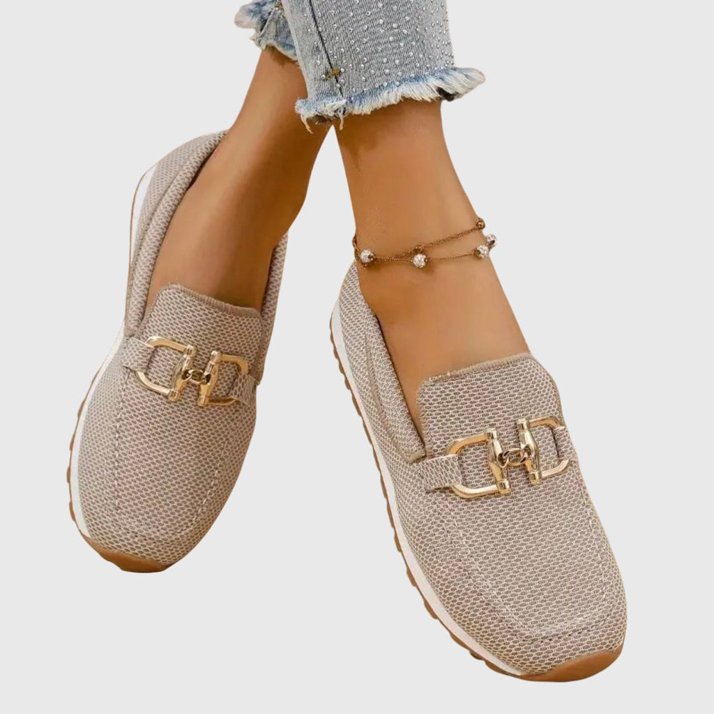 Women's textured loafer sneakers with rounded toes and decorative metal trims
