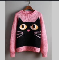 Women's color block sweater with cat motifs, distressed edges and stitched panel details