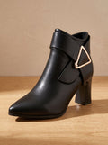 Women's pointed toe ankle boots with wraparound strap, triangular buckle and block heel