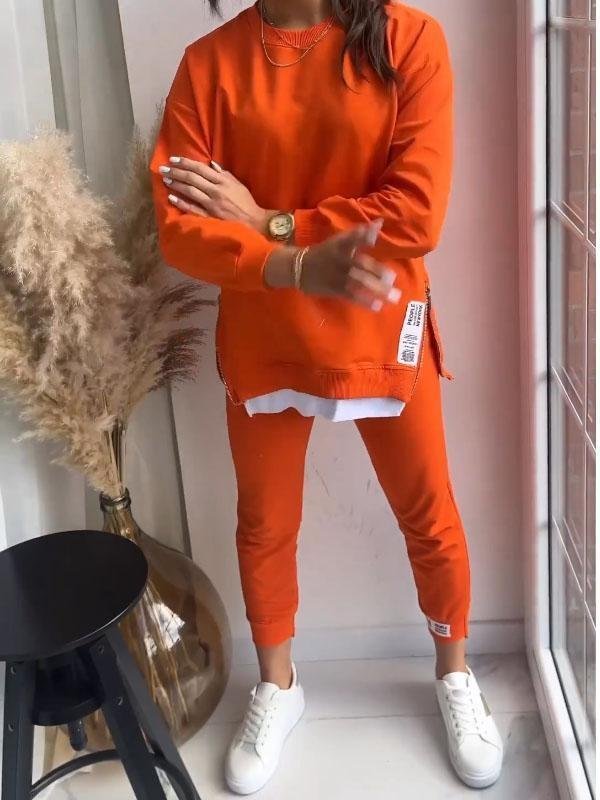 Women's crew neck sweatshirt and tapered jogger set with side zips and layered hem