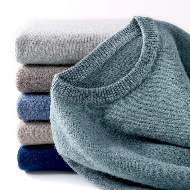 Men's textured knit crew neck sweater shown in light blue and black with long sleeves and ribbed edges