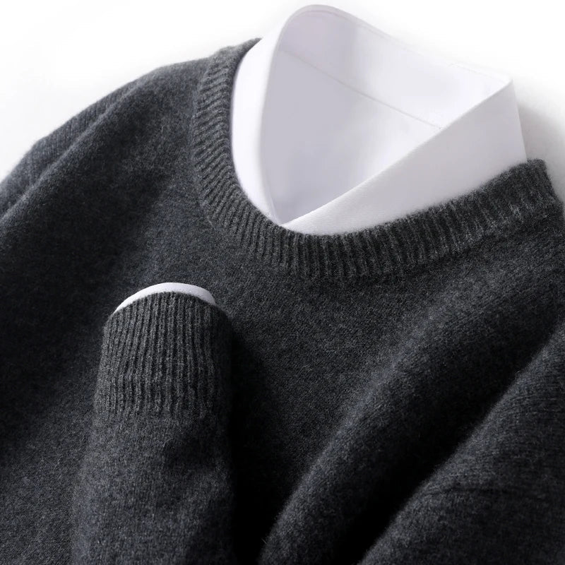 Men's textured knit crew neck sweater shown in light blue and black with long sleeves and ribbed edges