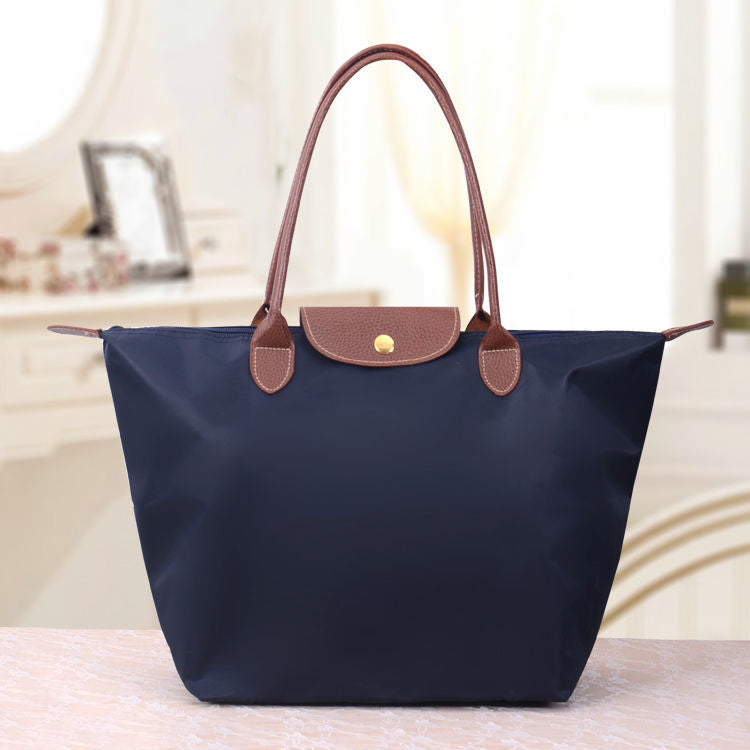 Sac cabas pliable en nylon avec bordure en cuir