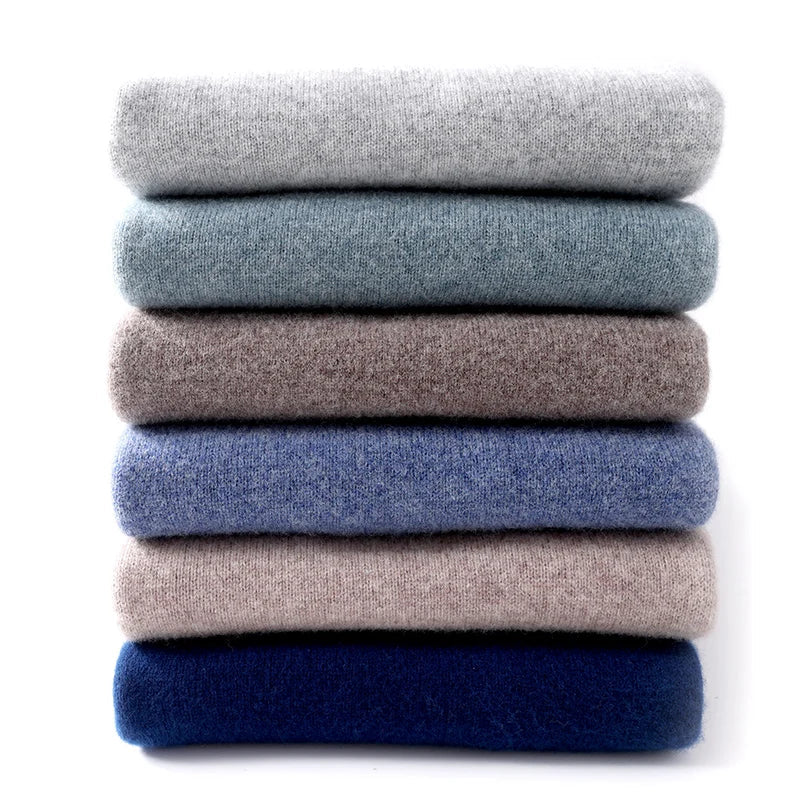 Men's textured knit crew neck sweater shown in light blue and black with long sleeves and ribbed edges