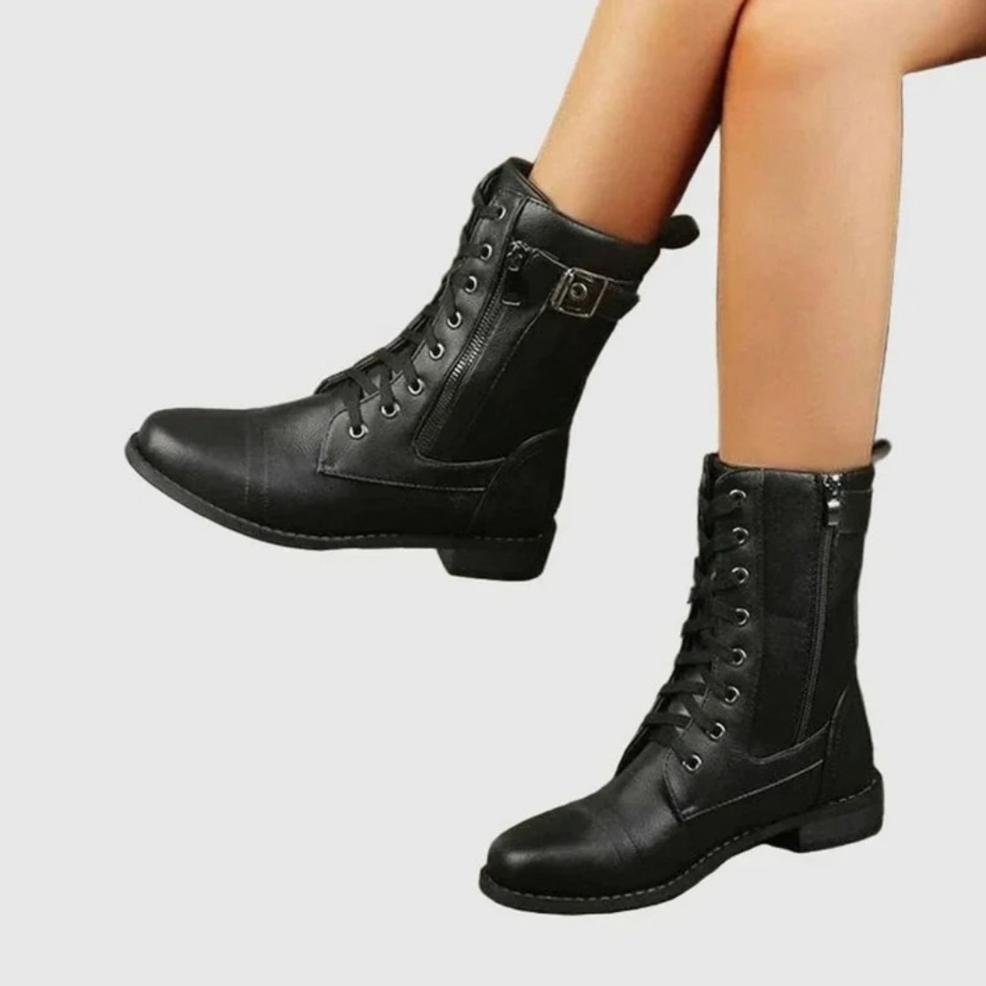 Women's lace-up combat boots with side zippers and buckle straps