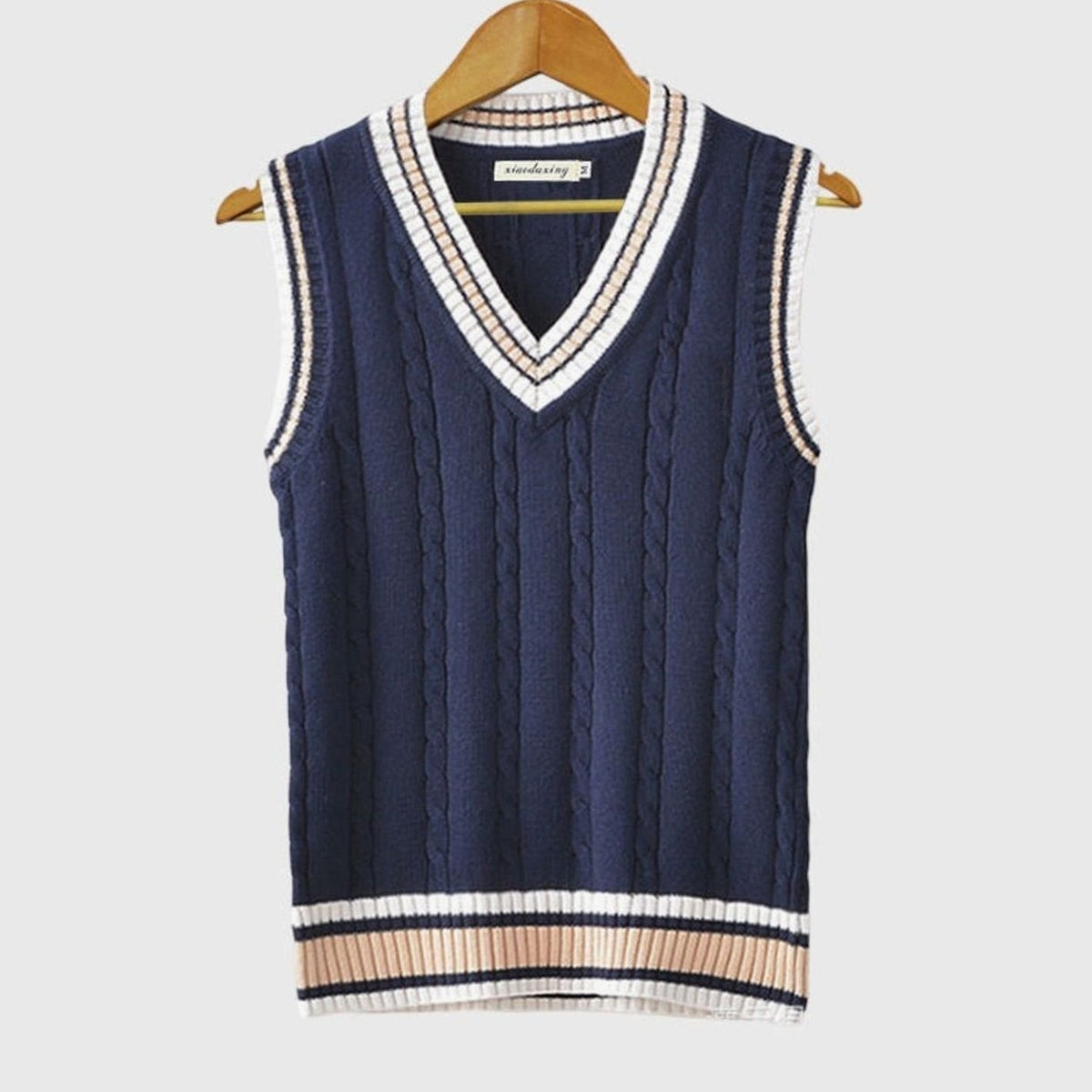 Women's striped cable-knit sweater vest with V-neck and contrast trim