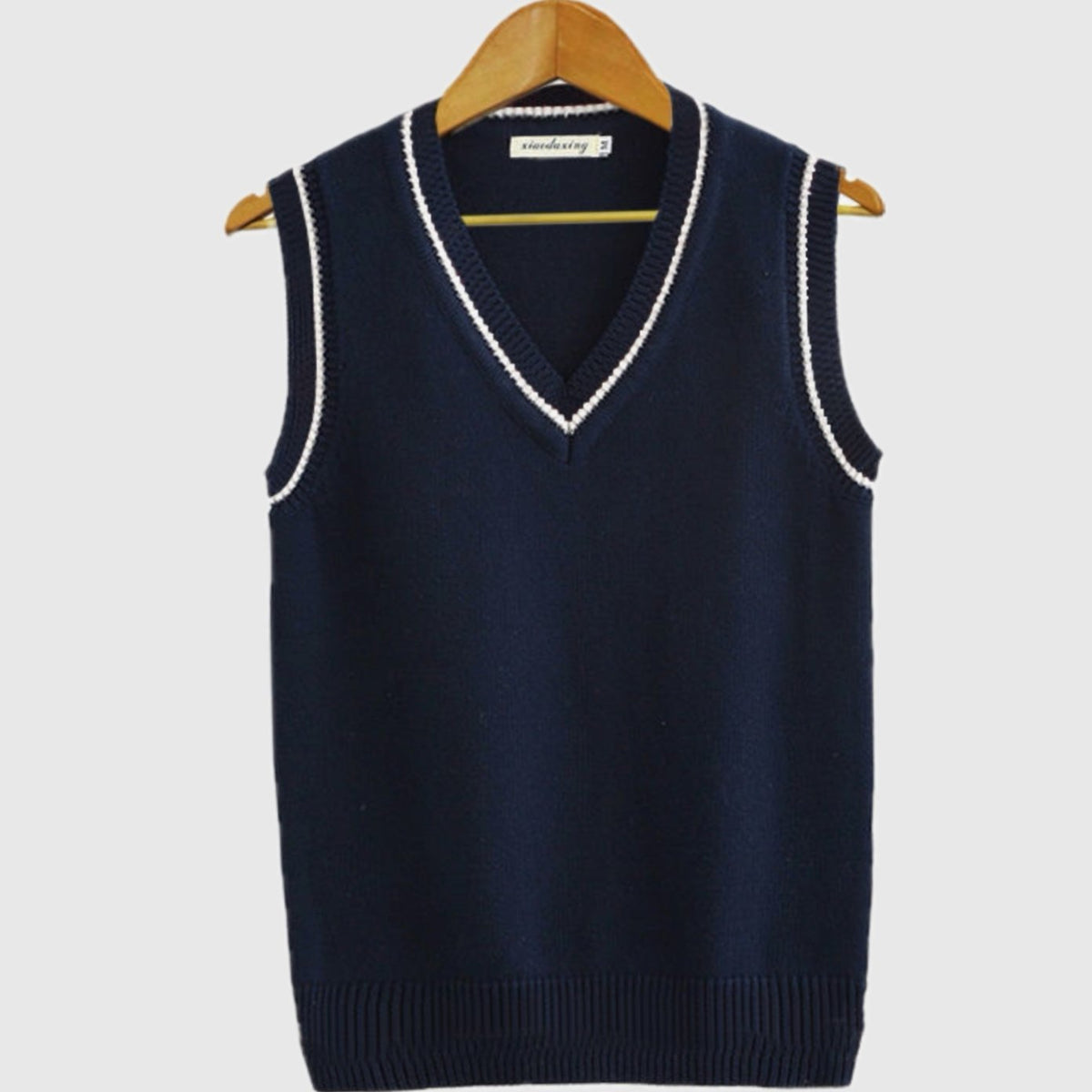 Women's striped cable-knit sweater vest with V-neck and contrast trim