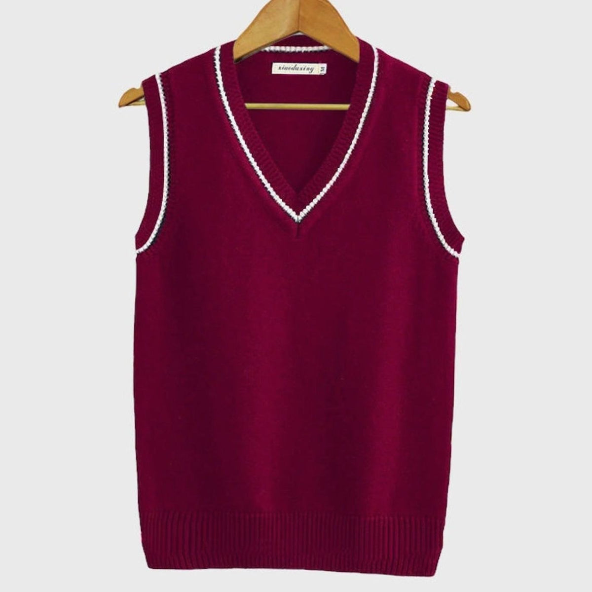Women's striped cable-knit sweater vest with V-neck and contrast trim