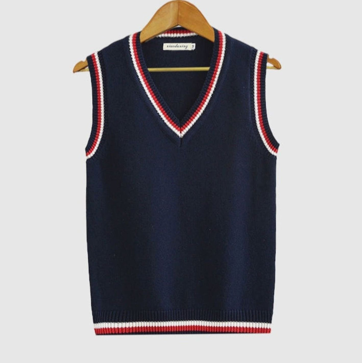 Women's striped cable-knit sweater vest with V-neck and contrast trim