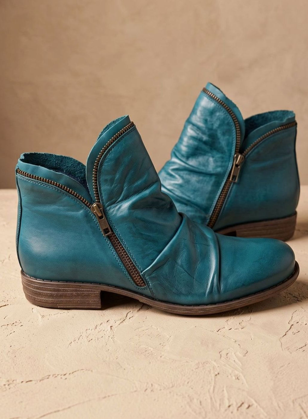 Women's ruched ankle boots with asymmetric side zippers and low stacked heels