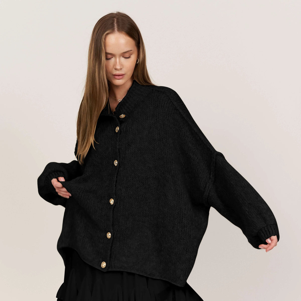 Women's oversized chunky knit cardigan with long sleeves and gold-tone buttons