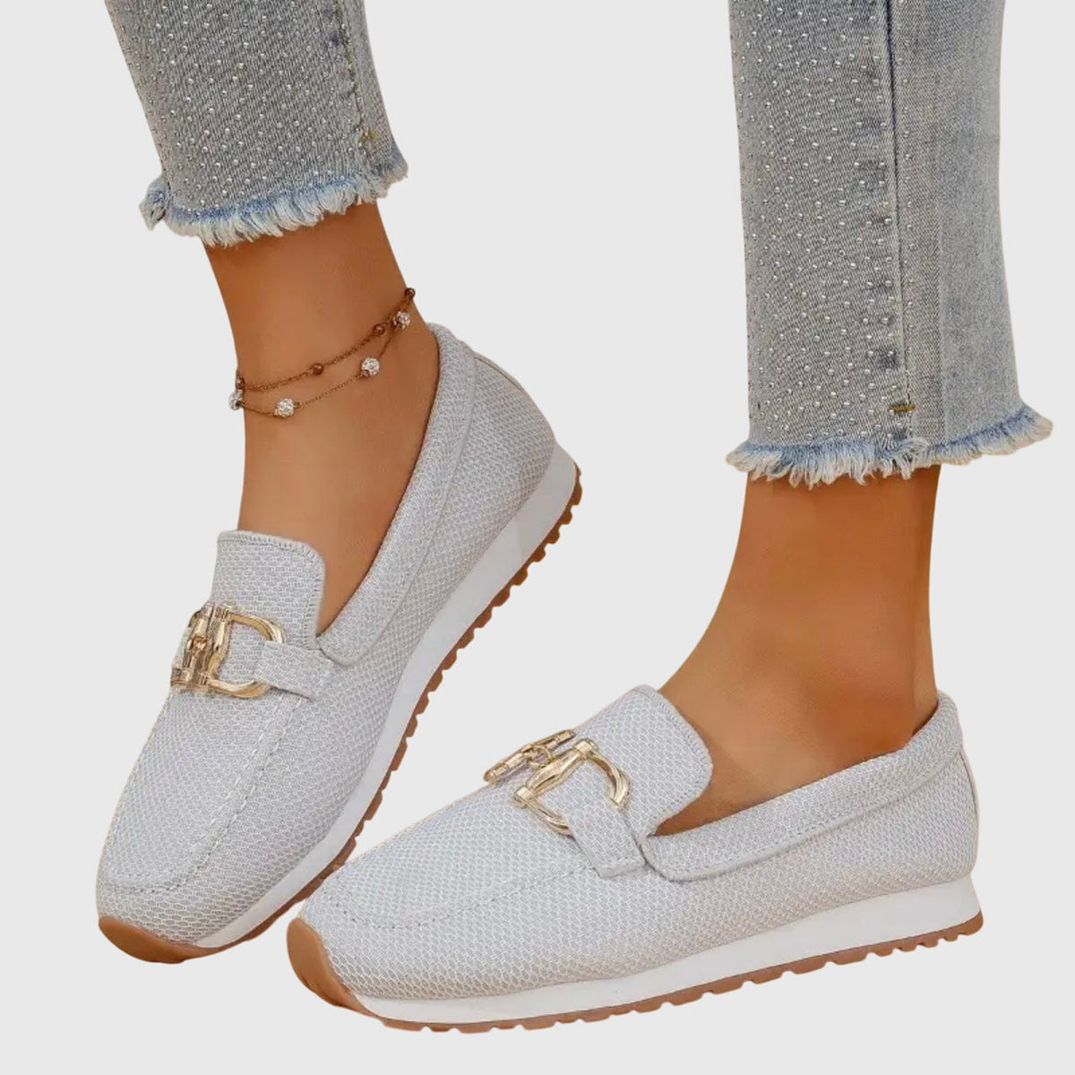 Women's textured loafer sneakers with rounded toes and decorative metal trims