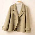 Women's short double-breasted coat with notch lapels, long sleeves and buttoned cuff tabs