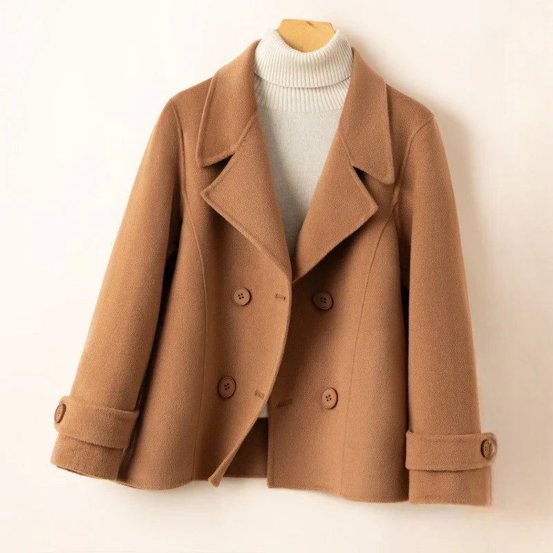 Women's short double-breasted coat with notch lapels, long sleeves and buttoned cuff tabs