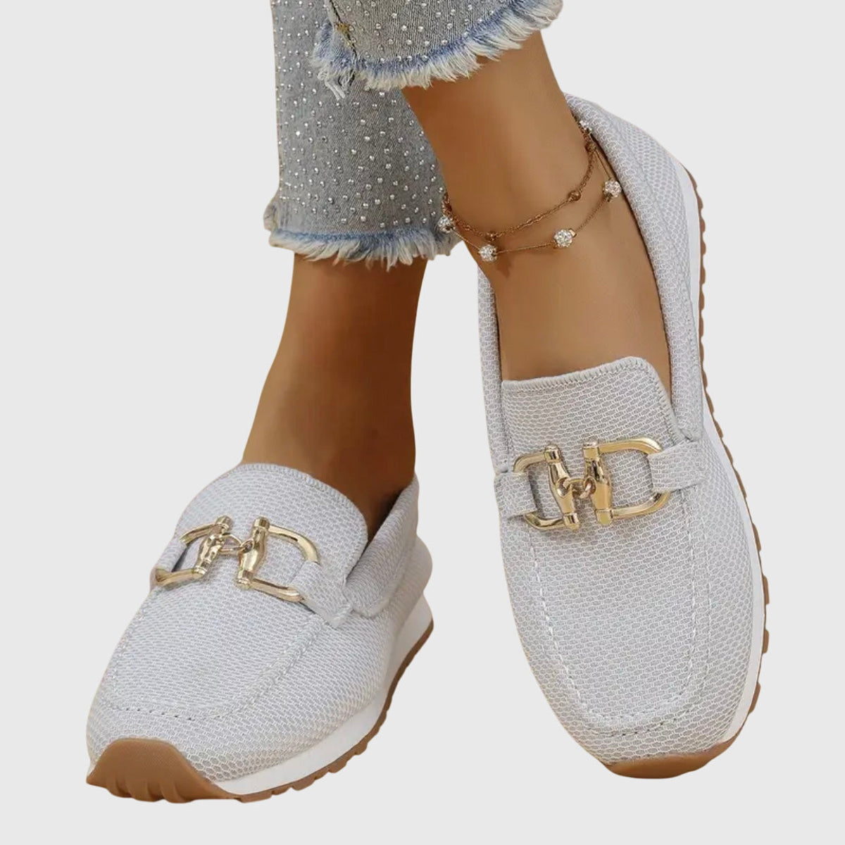 Women's textured loafer sneakers with rounded toes and decorative metal trims