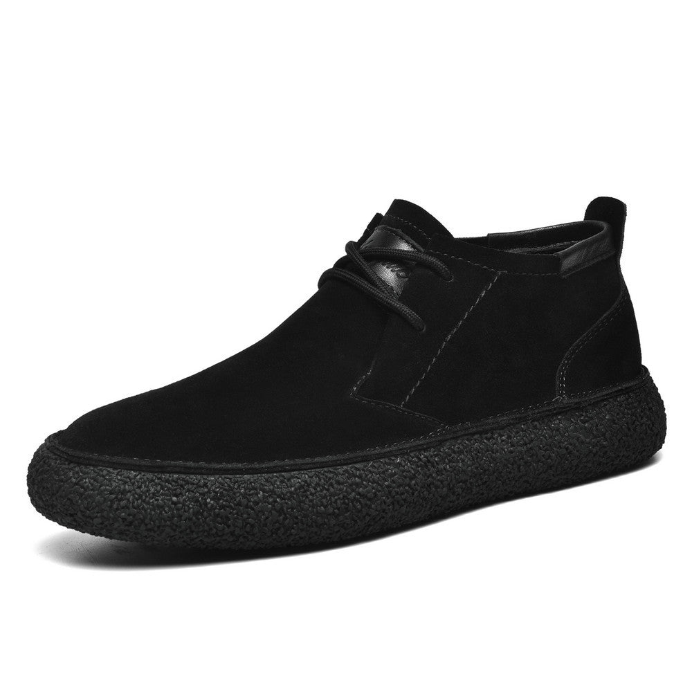 Men's lace-up chukka ankle boots with rounded toes, dark collar trim and textured soles