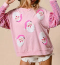 Women's pink Christmas sweatshirt with Santa motifs and sequin sleeves