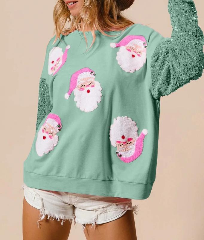 Women's pink Christmas sweatshirt with Santa motifs and sequin sleeves