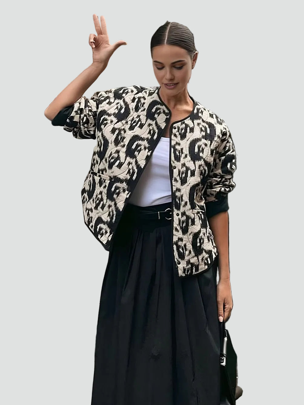 Women's black and white abstract animal print quilted collarless jacket