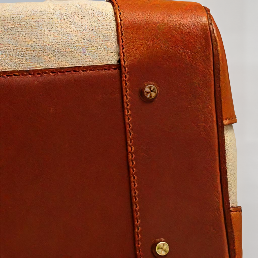 Women's two-tone brown and cream structured top handle bag with turn-lock flap